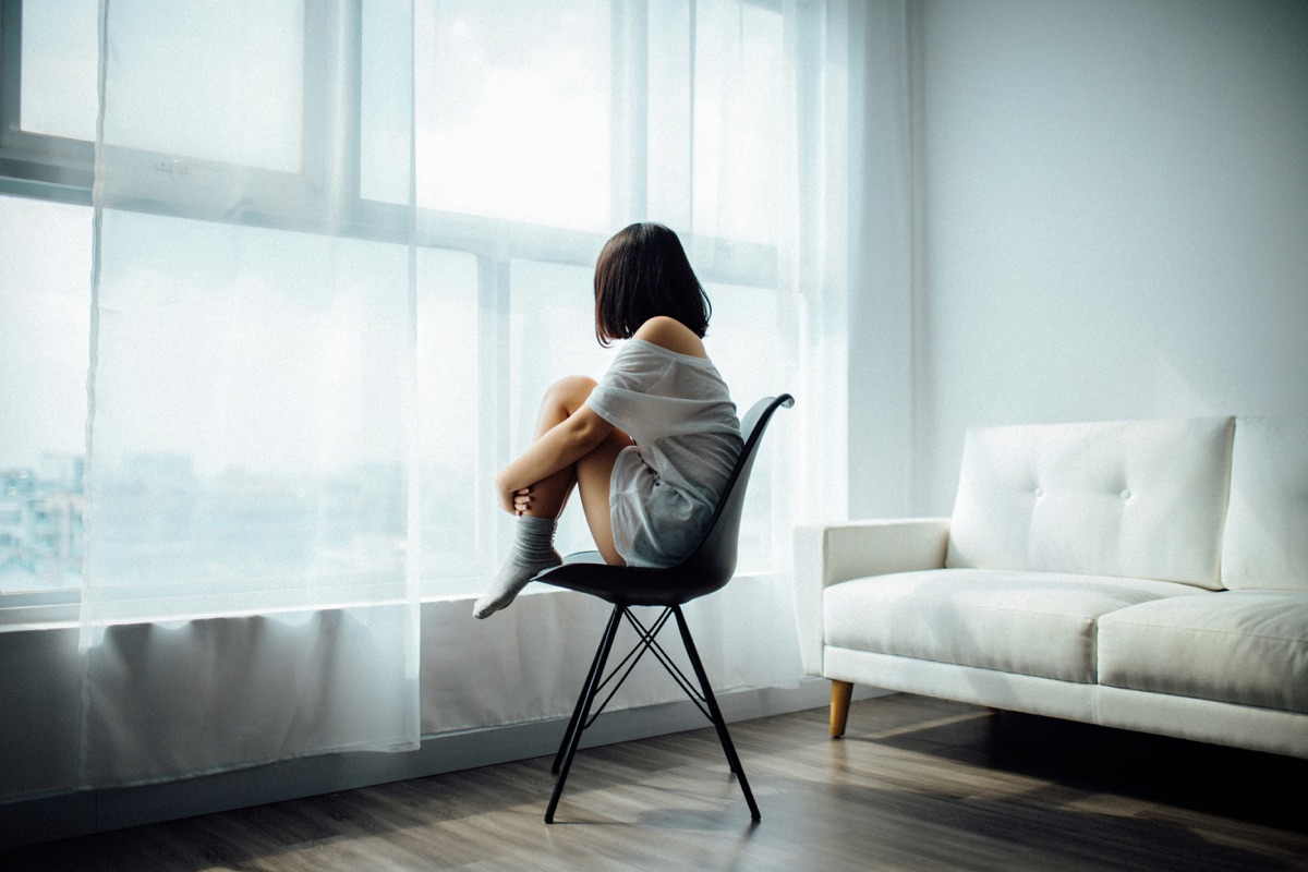 Person sitting quietly, reflecting — recognizing the signs of depression and when to seek therapy in Cedar City, Utah